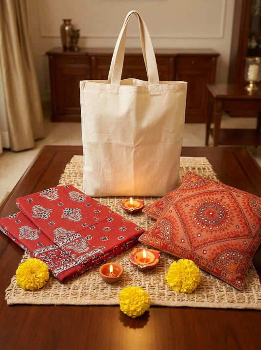 Emenaura Ajrakh print premium cotton bedsheet set with two embroidered cushion covers, vibrant traditional design for festive decor.
