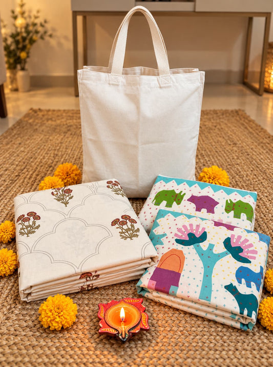 Emenaura festive cotton bedsheet set with one hand-block printed bedsheet and two embroidered cushion covers, decorative textiles and tote