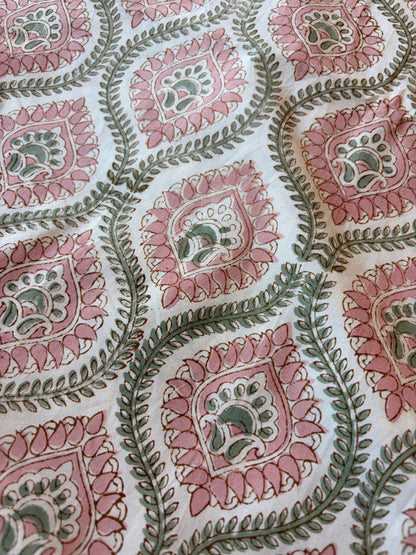 Emenaura blush geometric cotton bedsheet set with matching pillowcases, featuring modern design and soft fabric for comfort.