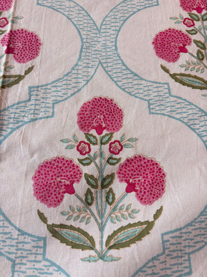 Emenaura Blossom Garden cotton bedsheet with floral pattern, soft fabric, and pastel colors draped on a bed.