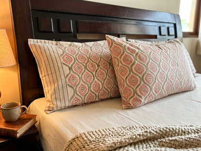 Emenaura blush geometric cotton bedsheet set with matching pillows, soft and stylish bedding for a modern bedroom decor.