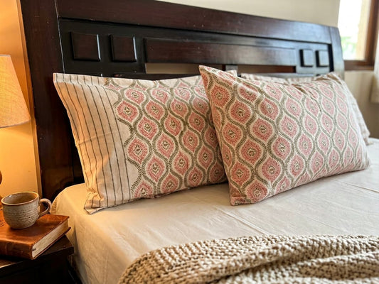 Emenaura blush geometric cotton bedsheet set with matching pillows, soft and stylish bedding for a modern bedroom decor.