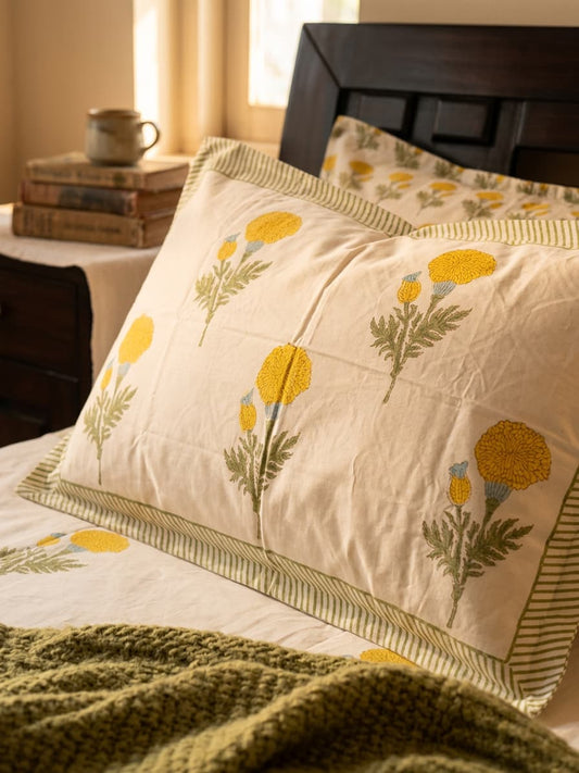 Emenaura Sunny Bloom cotton bedsheet with matching pillows in soft, vibrant floral print, showcasing a cozy bedroom setup.