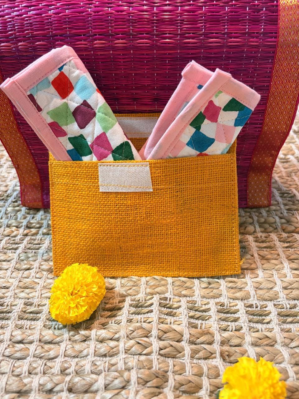 Set of four Emenaura Diwali-themed coasters in a pouch with a surprise gift, featuring colorful traditional designs.