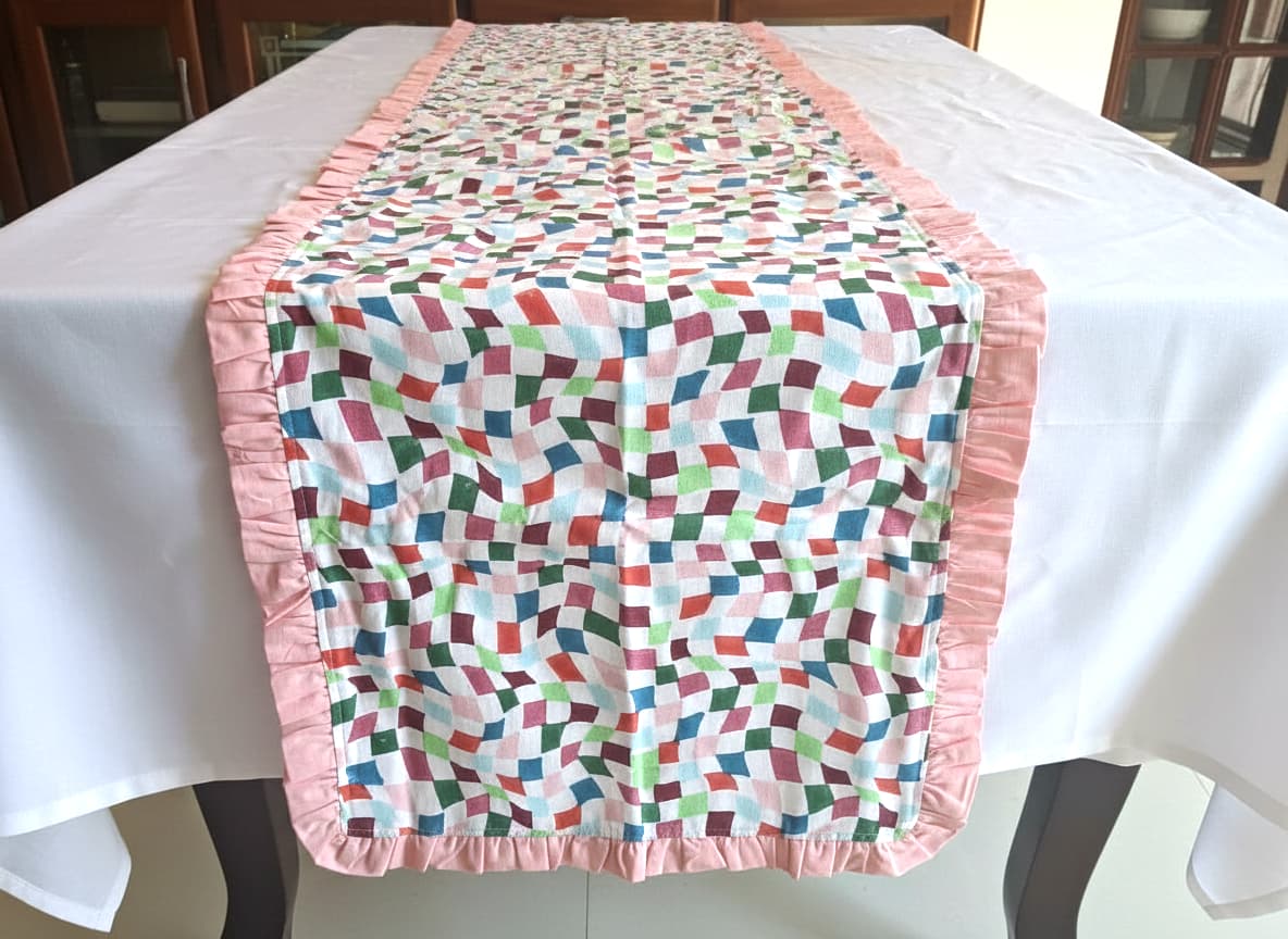Emenaura Grand Festive Bed Sheets set with pastel table runner, featuring elegant percale fabric and festive printed design.