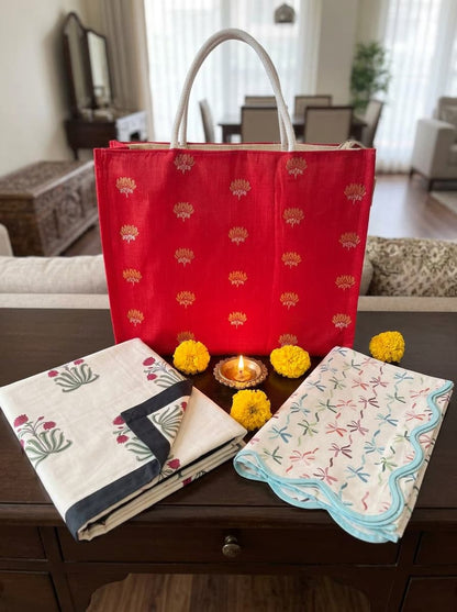 Emenaura red percale bed sheet set with a matching premium table runner, showcasing elegant festive home decor.
