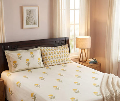 Emenaura Sunny Bloom cotton bedsheet with floral pattern spread neatly on a bed, showcasing soft, breathable fabric.