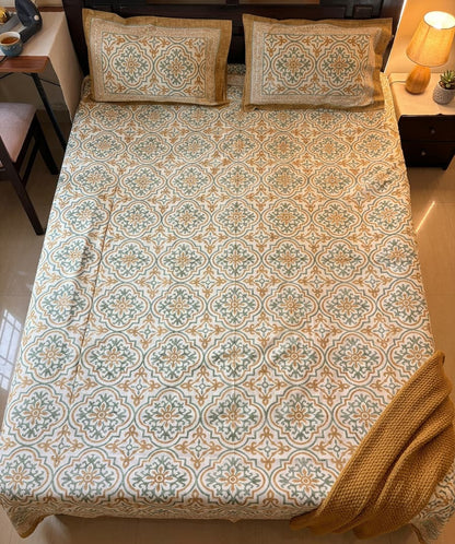 Emenaura Heritage Motif cotton bedsheet with intricate traditional patterns, shown from upper view.