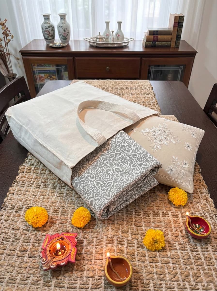 Emenaura white and grey premium cotton bedsheet set with two matching cushion covers, cozy and elegant bedroom decor.