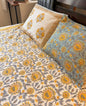 Sunlit Heritage Floral Cotton Bedsheet by Emenaura featuring vibrant floral patterns and soft cotton fabric for a cozy bedroom look.